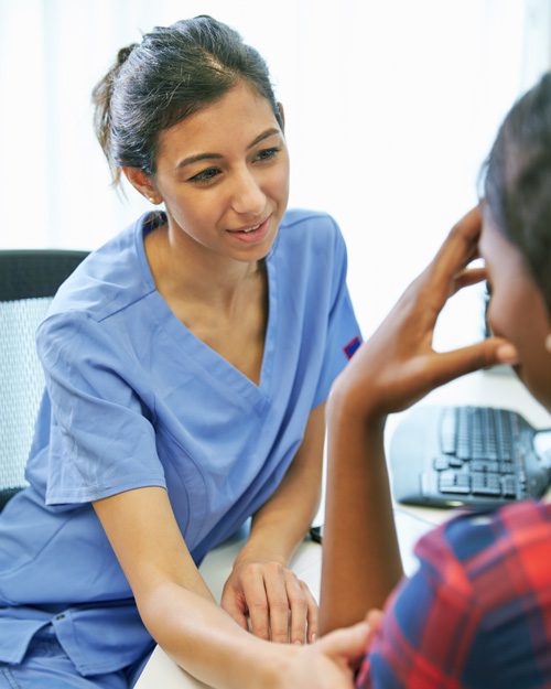 female nurse or tech comforting patient