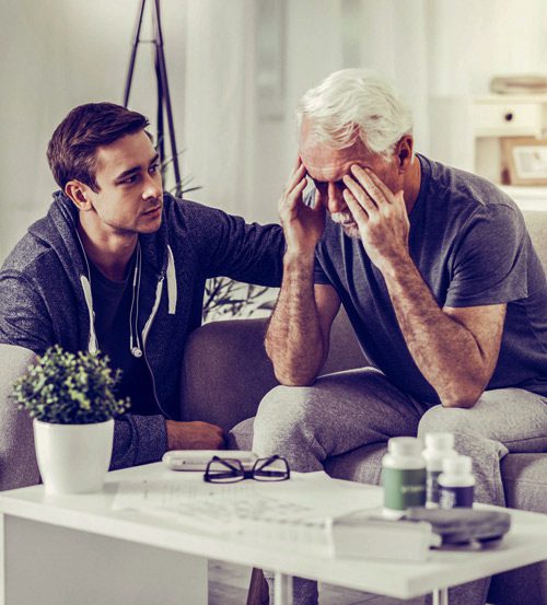 grown son with worried senior father