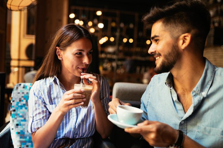 young attractive man and woman having a coffee date - relationship