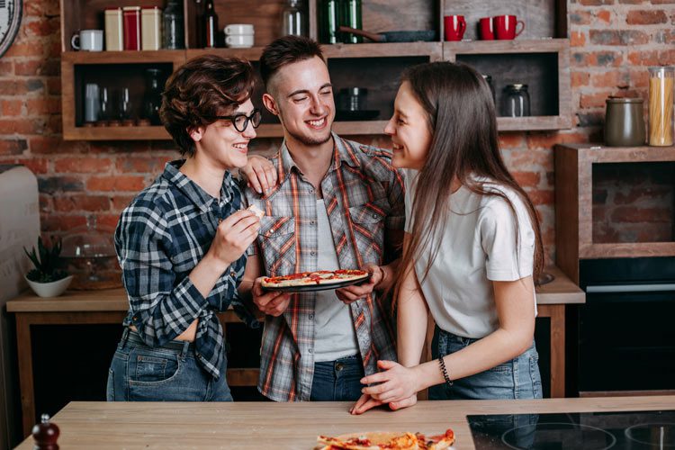 Be Sober & Happy, three young friends laughing and eating pizza together - sober and happy